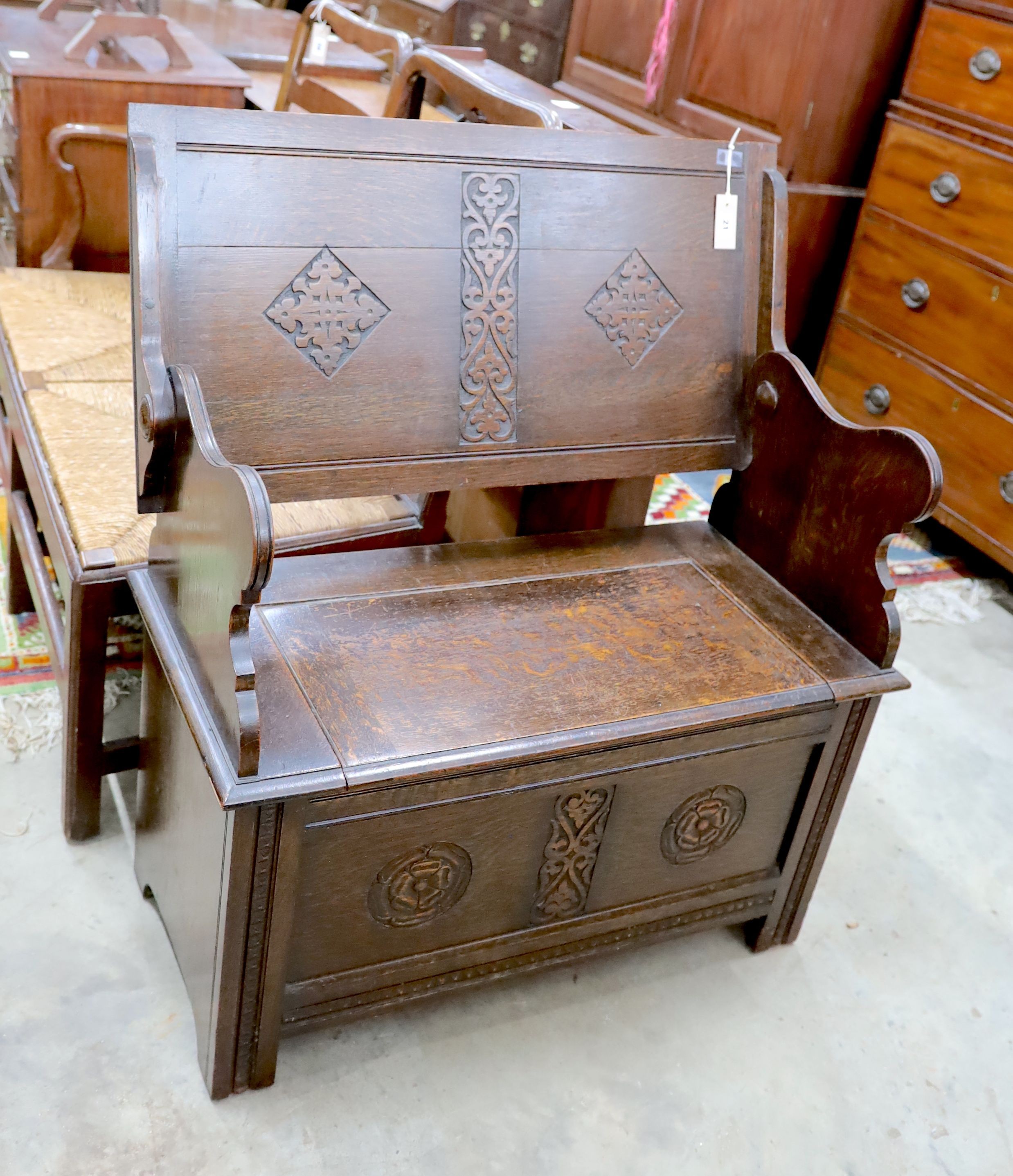 A 1930's oak monk's bench, length 87cm, depth 44cm, height 77cm